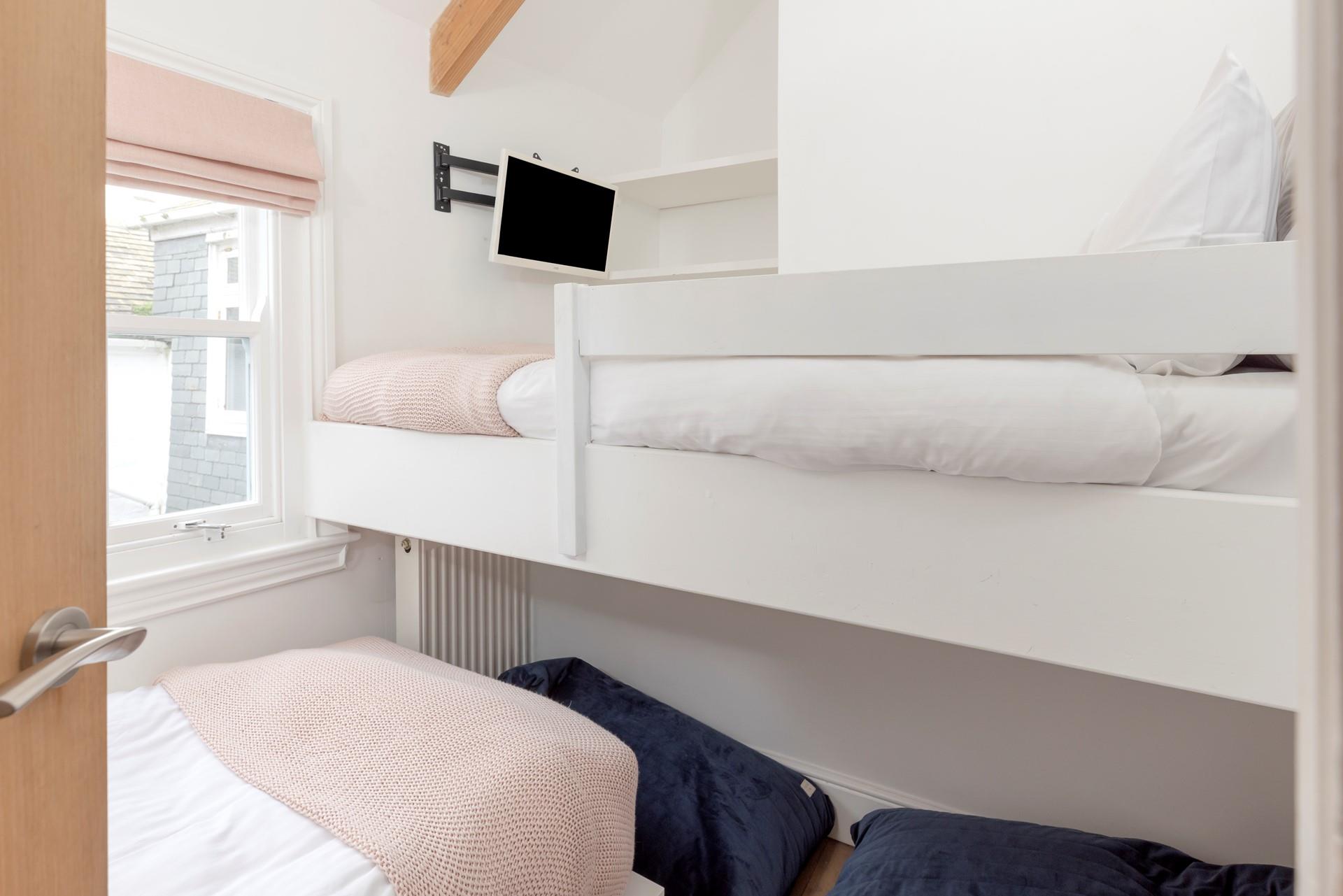 Bedroom 3 has a single bed and a single bunk.