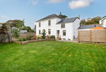 This stunning home has a large garden for enjoying summer days.