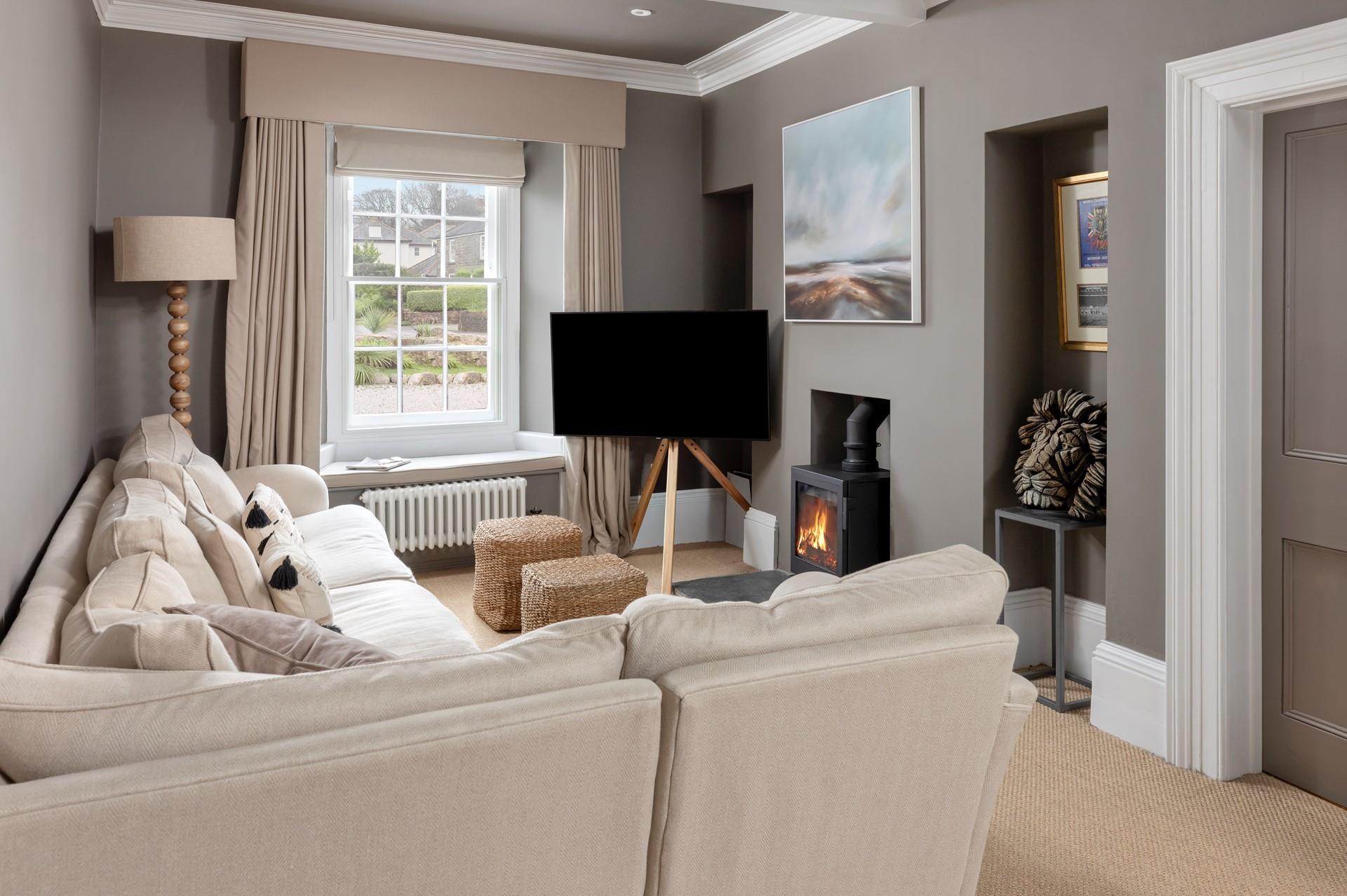 Cosy up in the sitting room with the crackle of the woodburner.