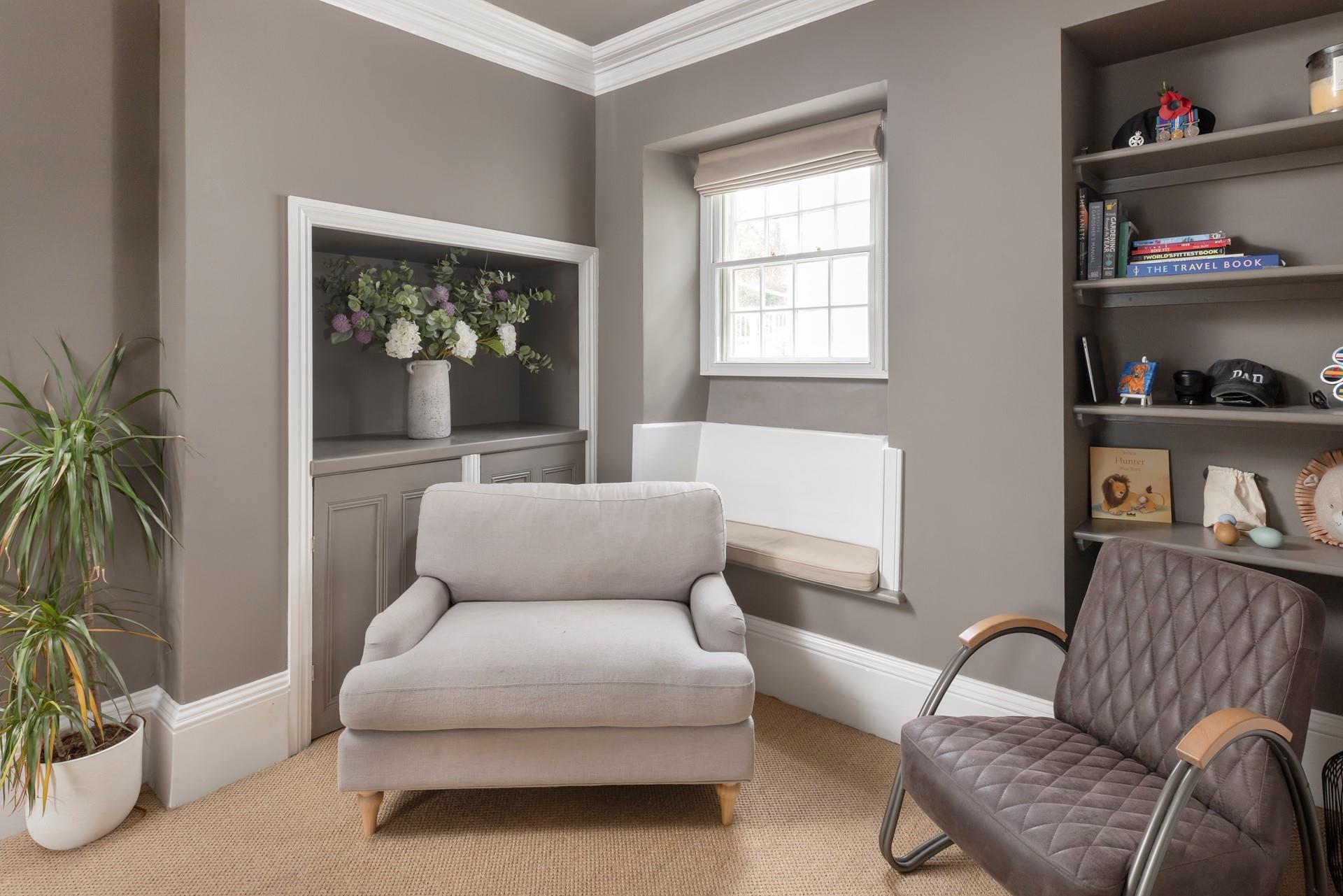 The stylish sitting room has space for the whole family to relax.