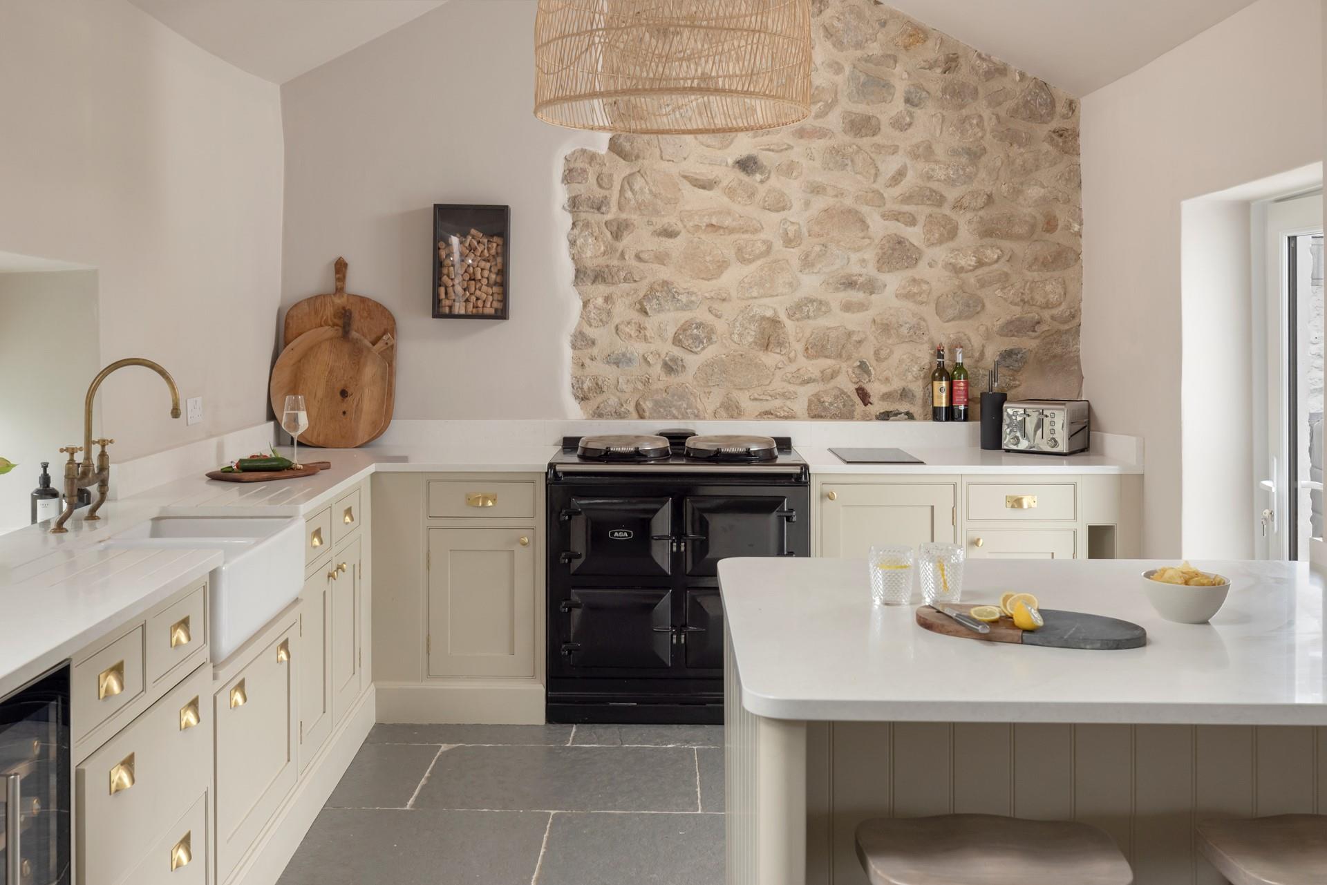 The kitchen is modern, with plenty of space to prepare meals.