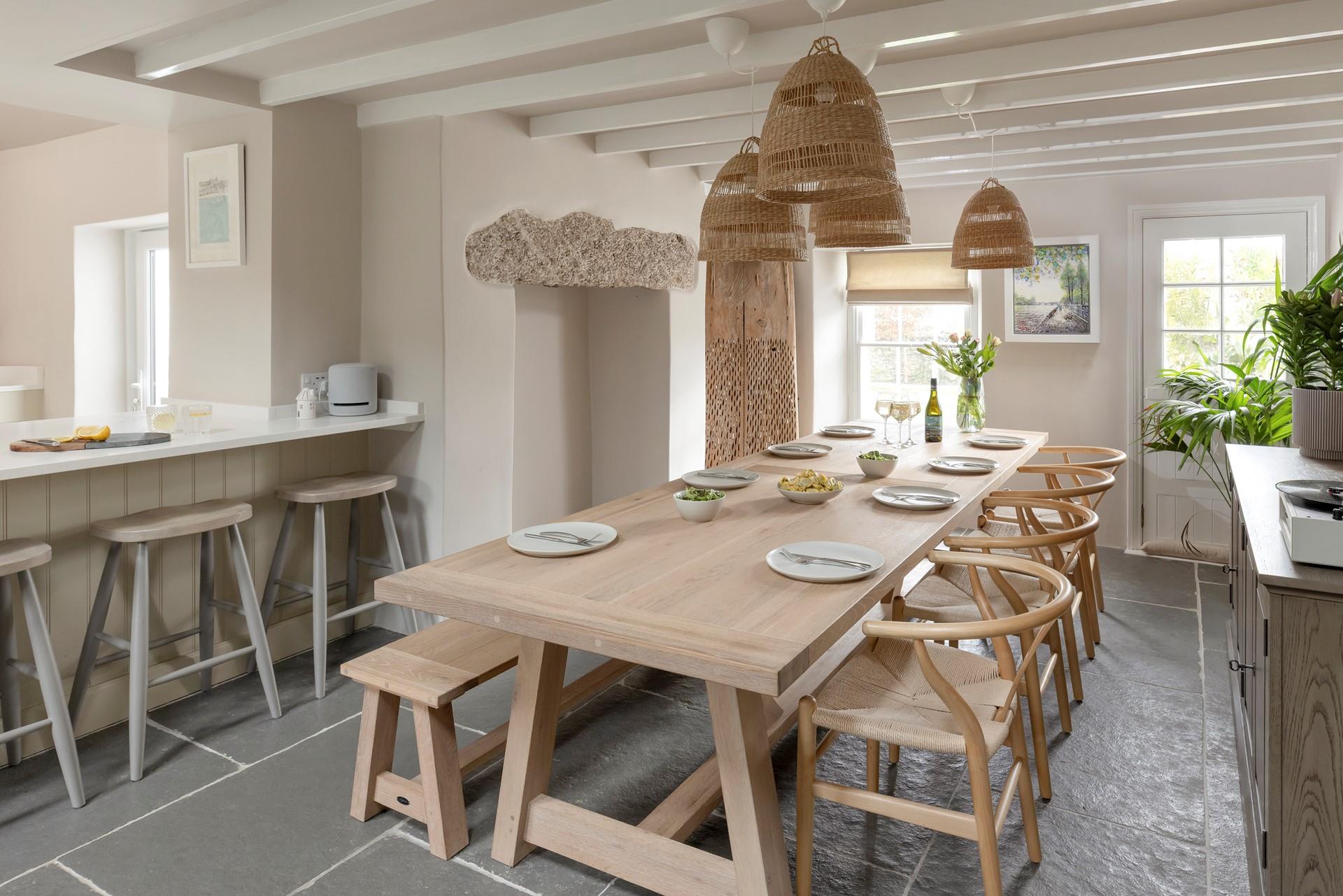 The open plan kitchen and dining area is light and modern, perfect for family feasts.