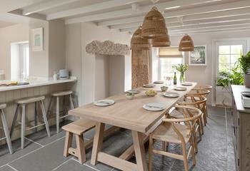 The open plan kitchen and dining area is light and modern, perfect for family feasts.