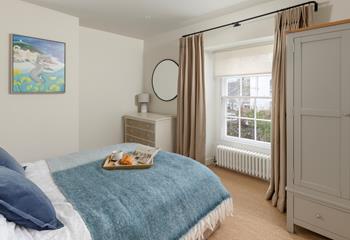 Bedroom 2 has a comfortable double bed and Cornish artwork.