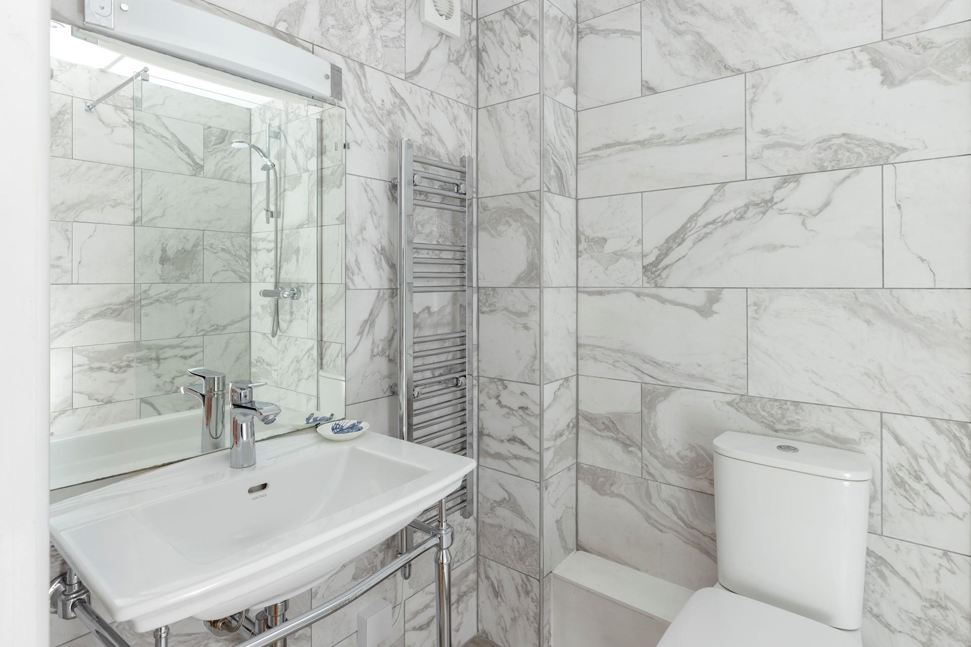The en suite shower room is ideal for getting ready each morning.
