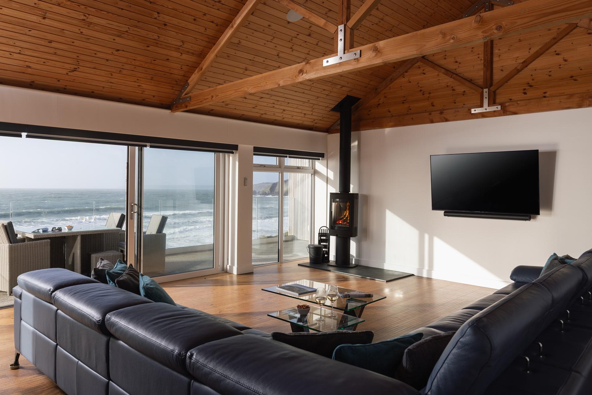 On chilly winter evenings, light the woodburner and watch the waves from the comfort of the sofa.