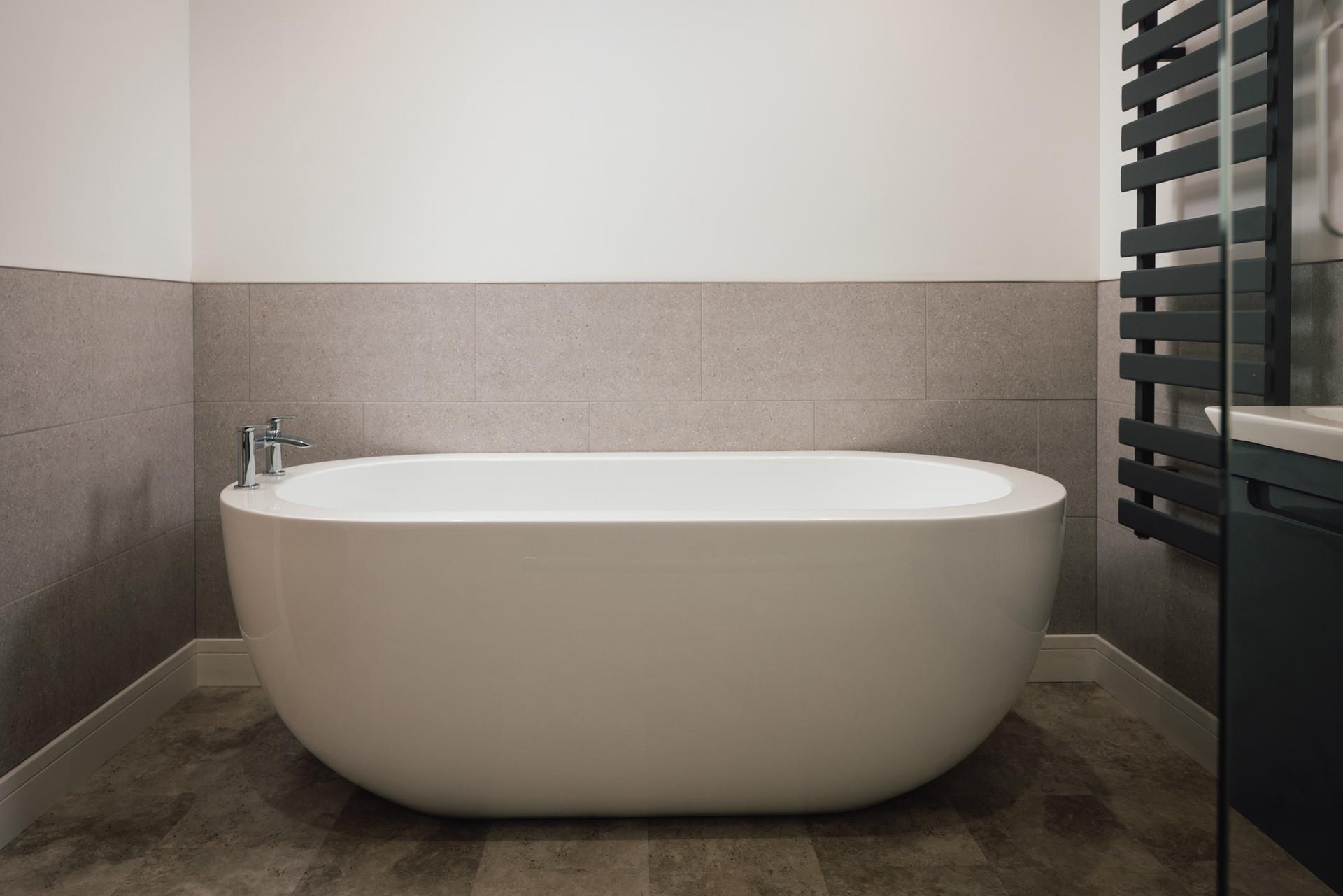 The free-standing bath offers a luxurious place to unwind after long days.