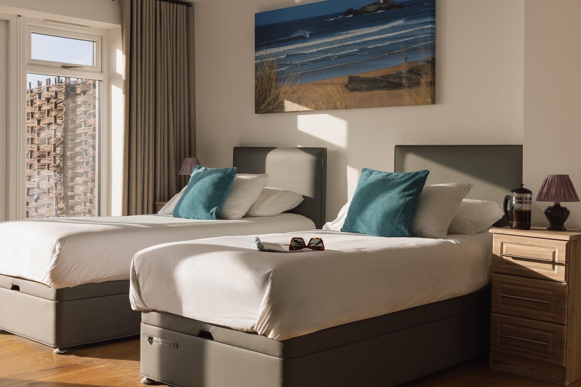 Beautiful coastal artwork features in the bedrooms.