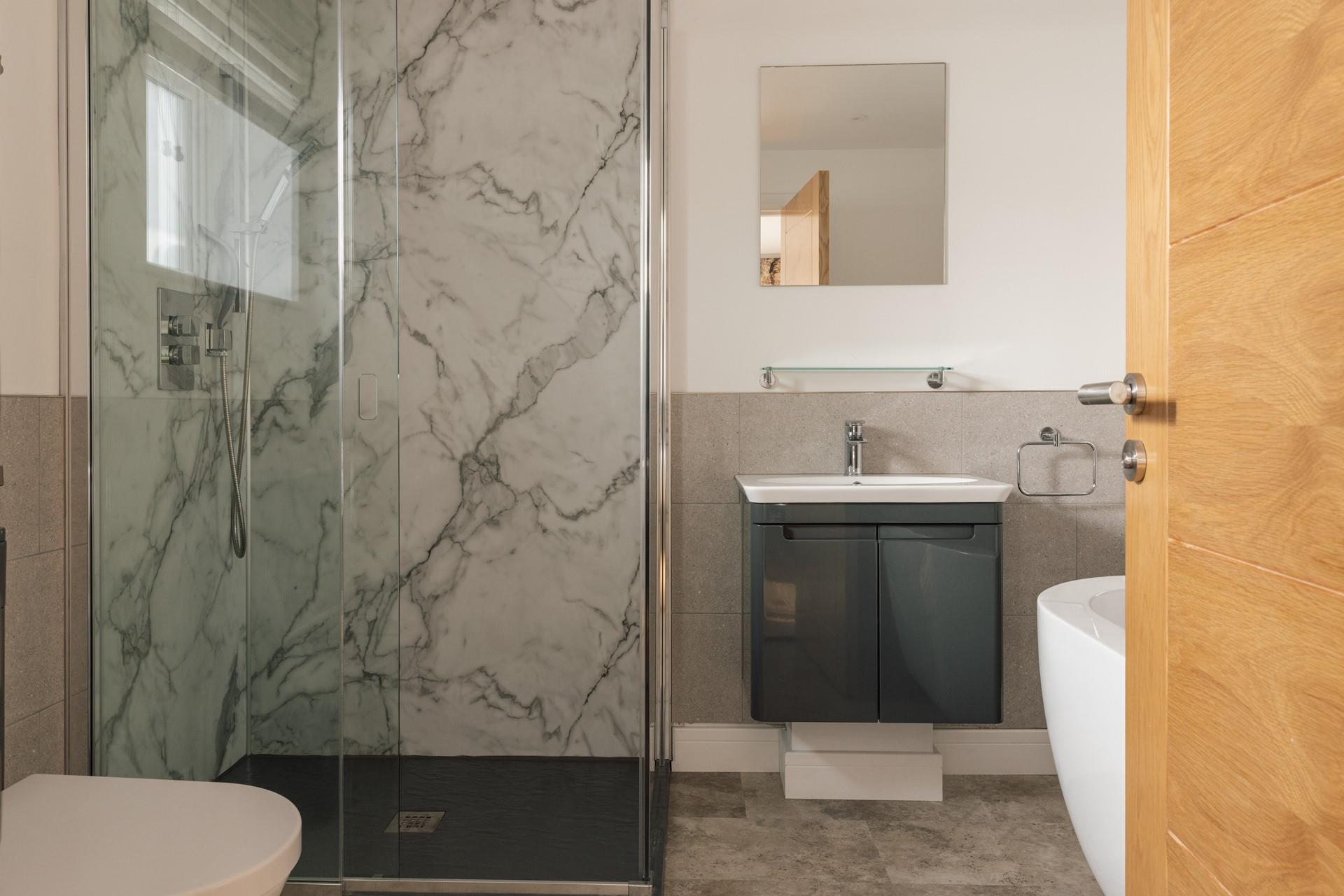 Modern and stylish, the bathrooms are luxurious spaces to get ready each morning.
