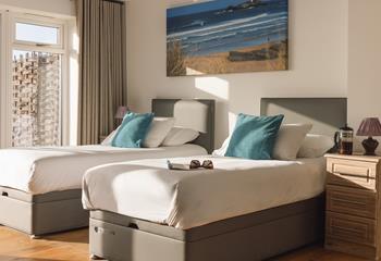 Beautiful coastal artwork features in the bedrooms.