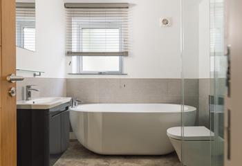 Unwind in a relaxing bubble bath after a coastal path ramble.