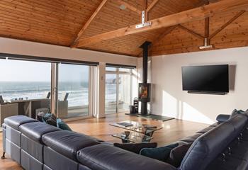 On chilly winter evenings, light the woodburner and watch the waves from the comfort of the sofa.