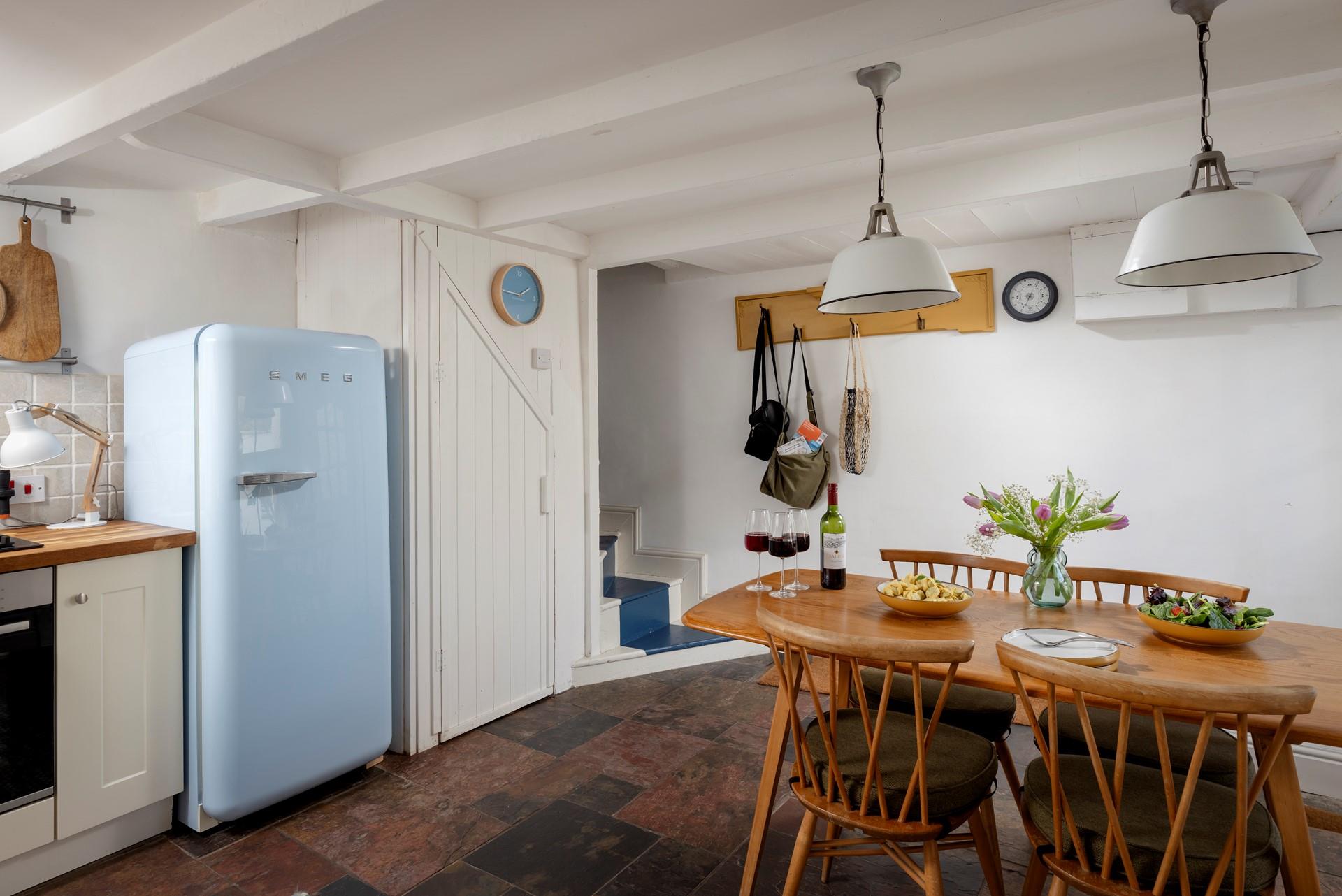The kitchen/diner has all you need, including a stylish Smeg fridge.
