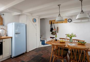 The kitchen/diner has all you need, including a stylish Smeg fridge.