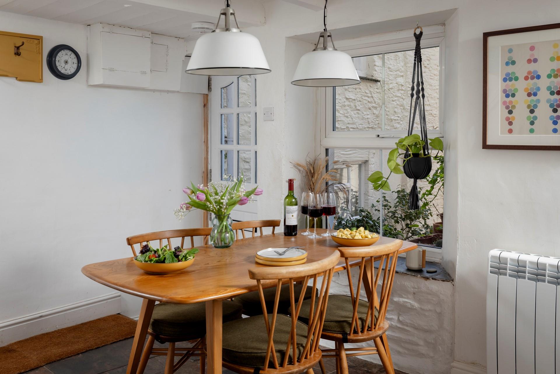 Relax around the dining table after a day of coastal adventures.