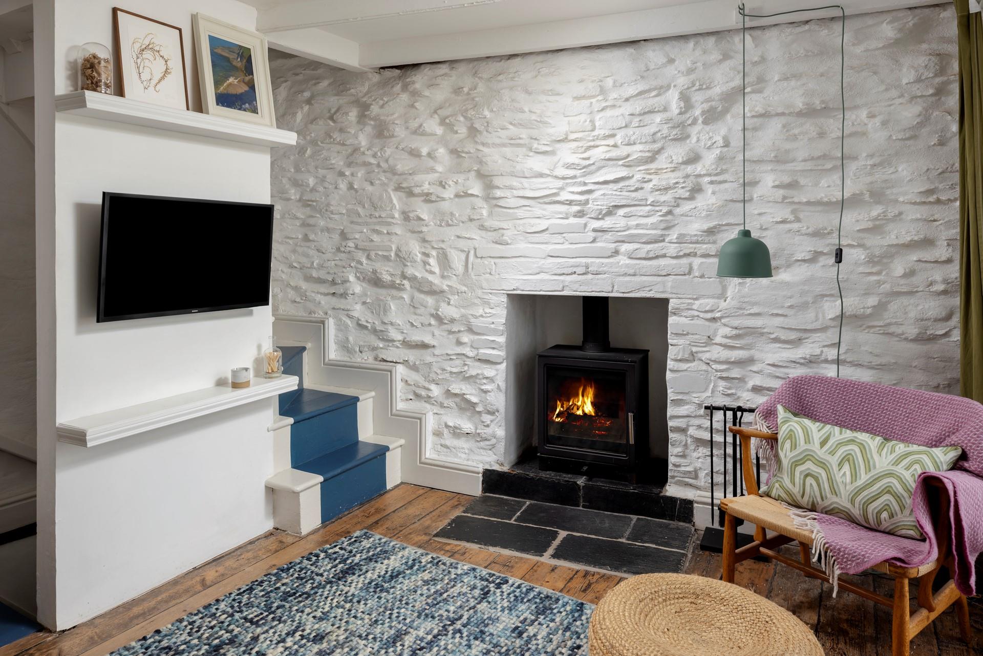 Let the sea breeze in during summer, and curl up by the woodburner in winter.