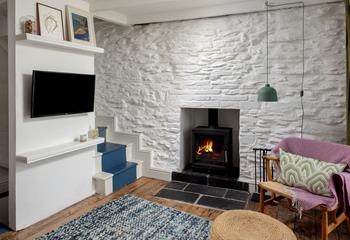 Let the sea breeze in during summer, and curl up by the woodburner in winter.