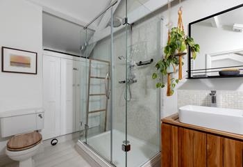 The bathroom blends modern amenities with stylish decor.