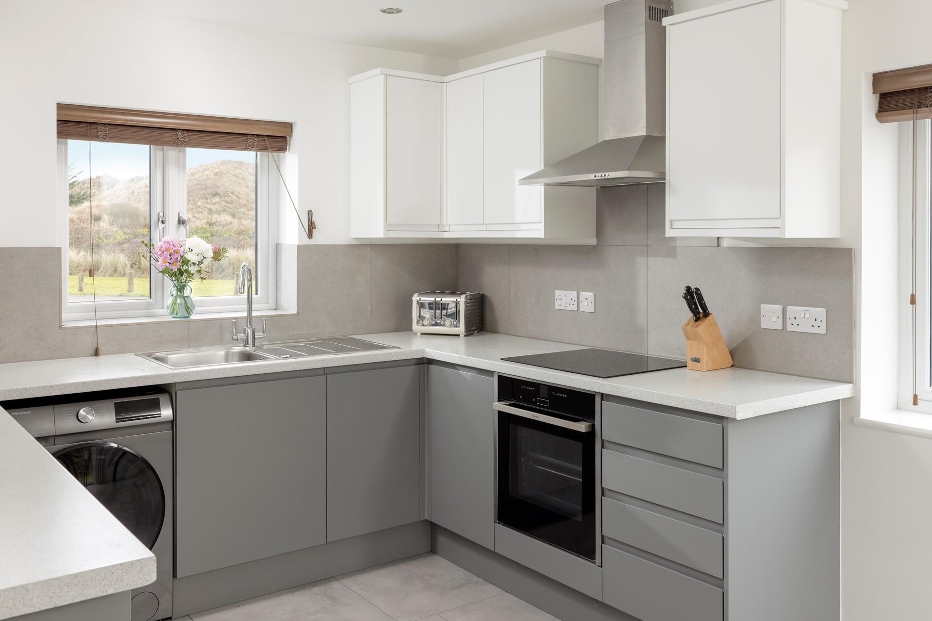 The kitchen is modern and fully equipped for all your culinary needs.