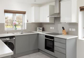 The kitchen is modern and fully equipped for all your culinary needs.