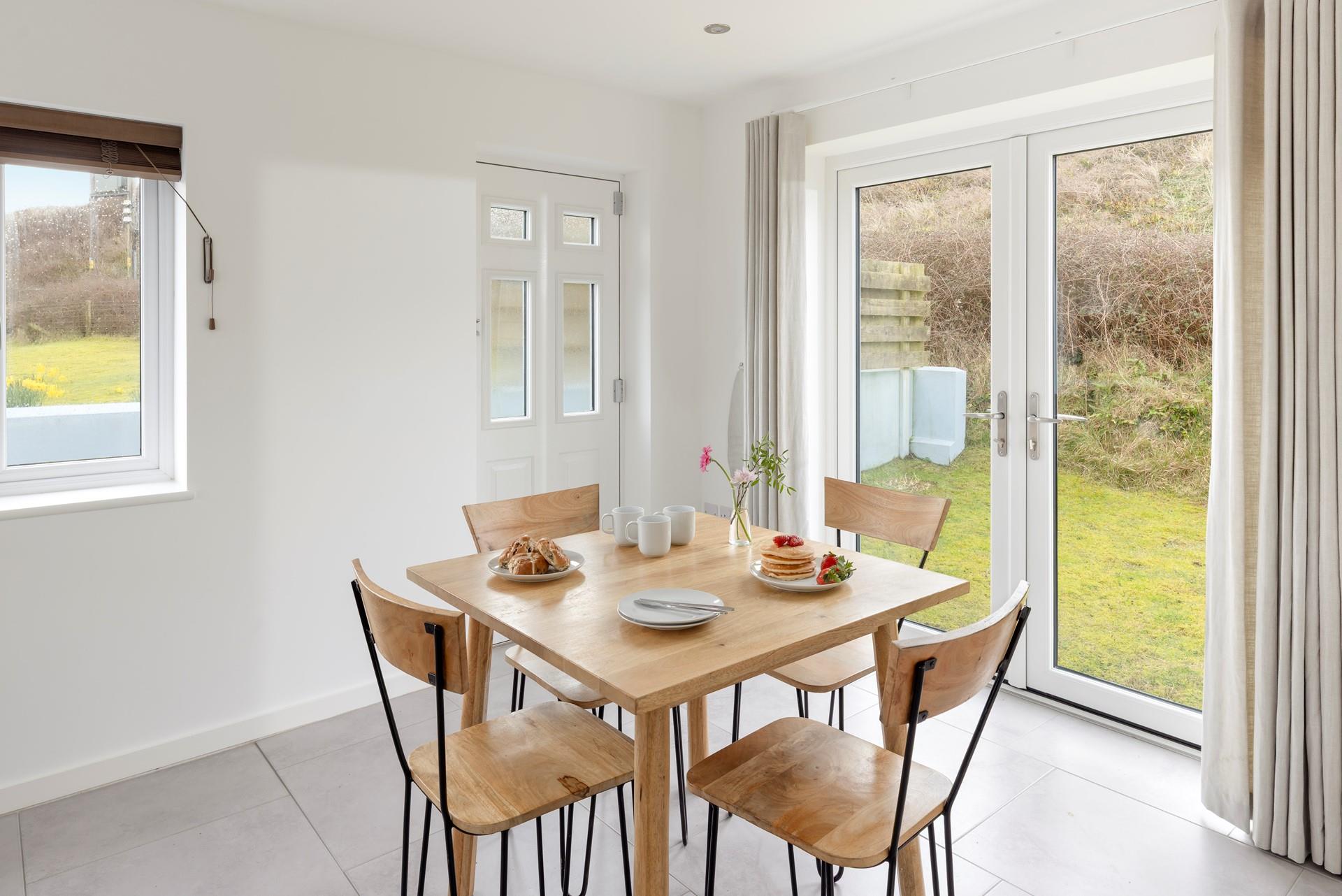 Open the patio doors to the garden and enjoy the warm summer breeze!