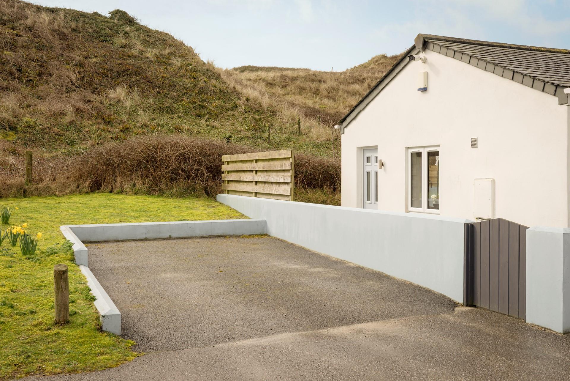 Allocated parking awaits outside the property.