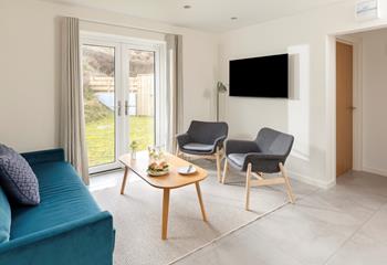 The sitting room is bright and airy with modern furnishings.