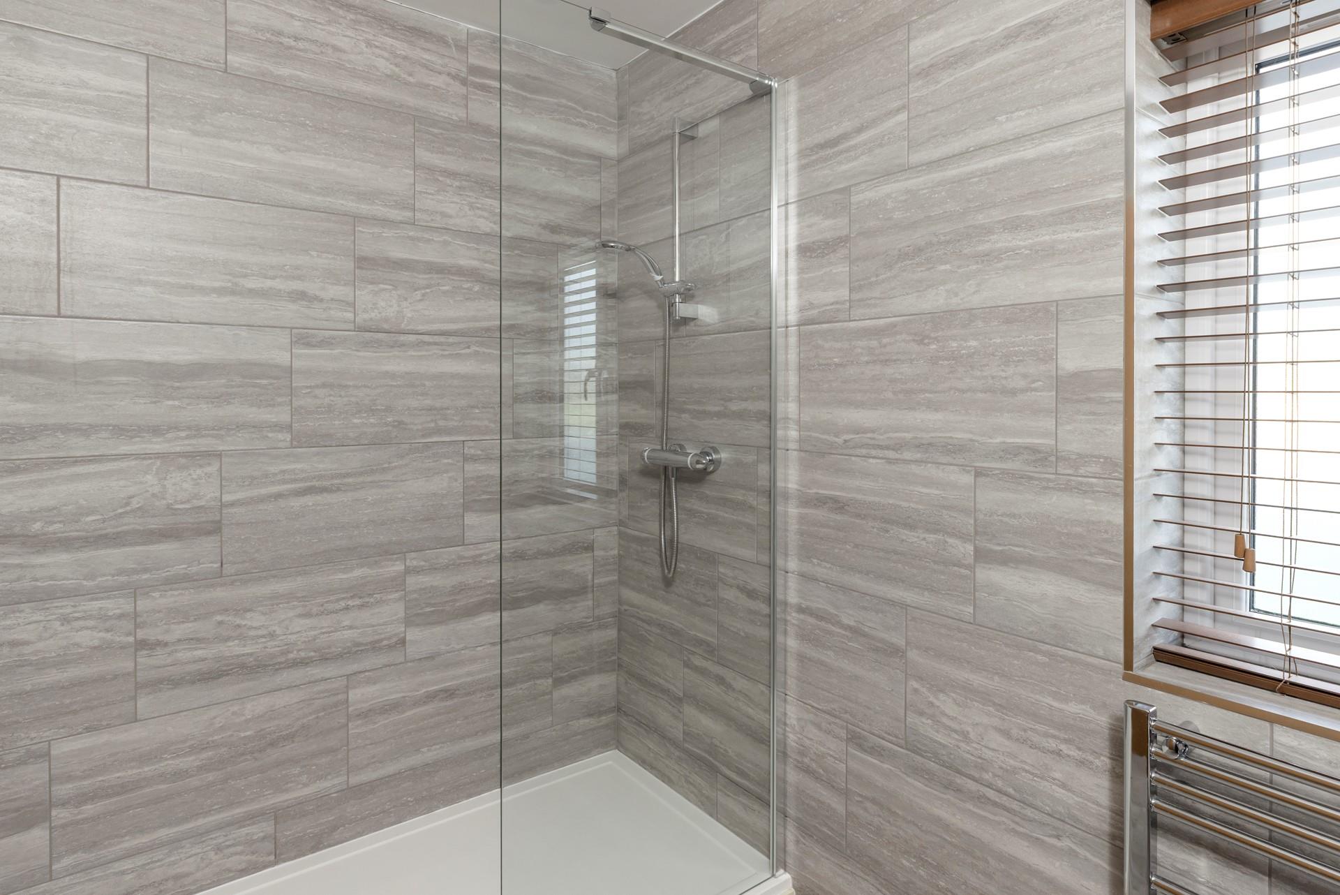 Wash the day away in the modern shower room.