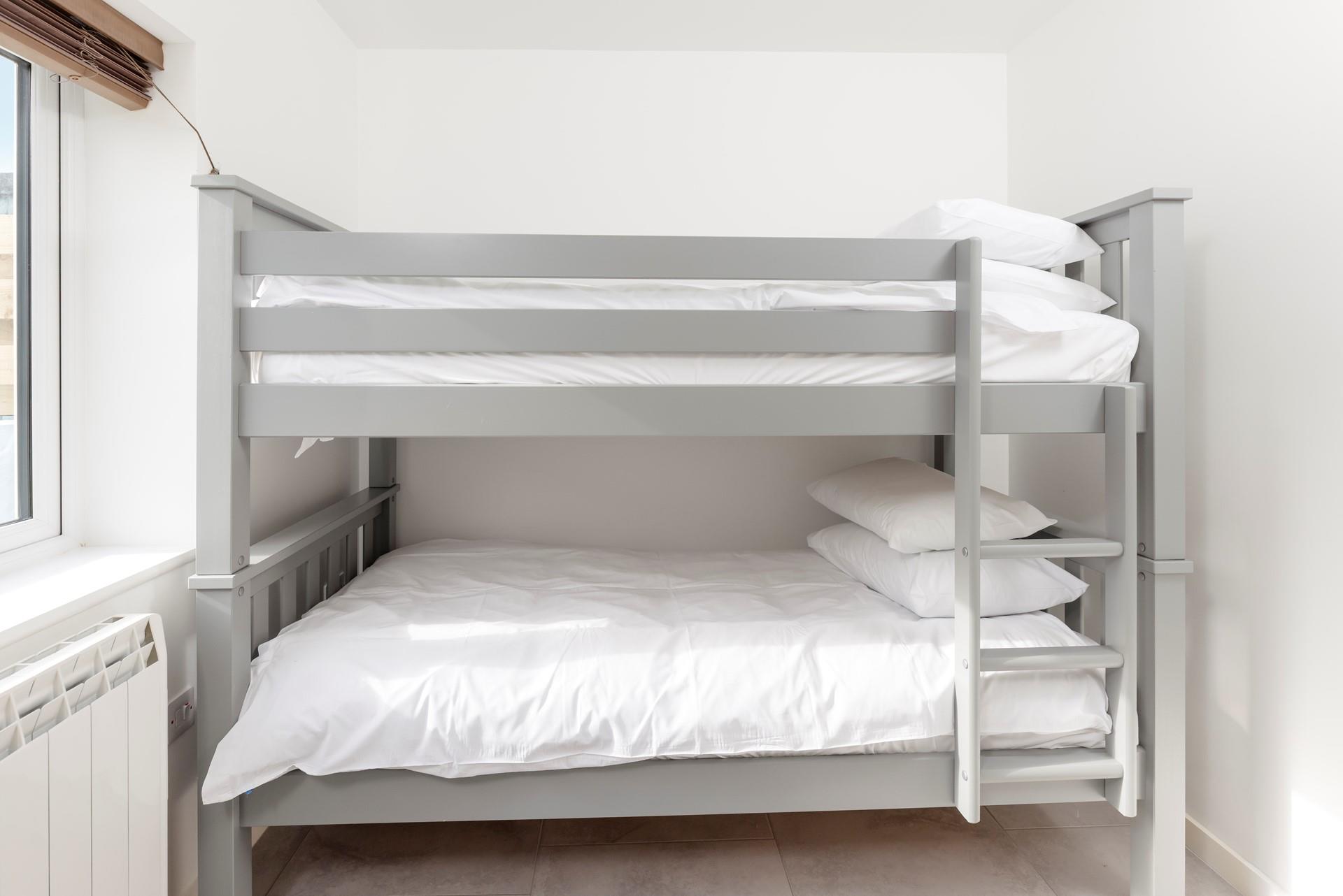 Tuck the kids into the bunk beds after a memorable beach day.