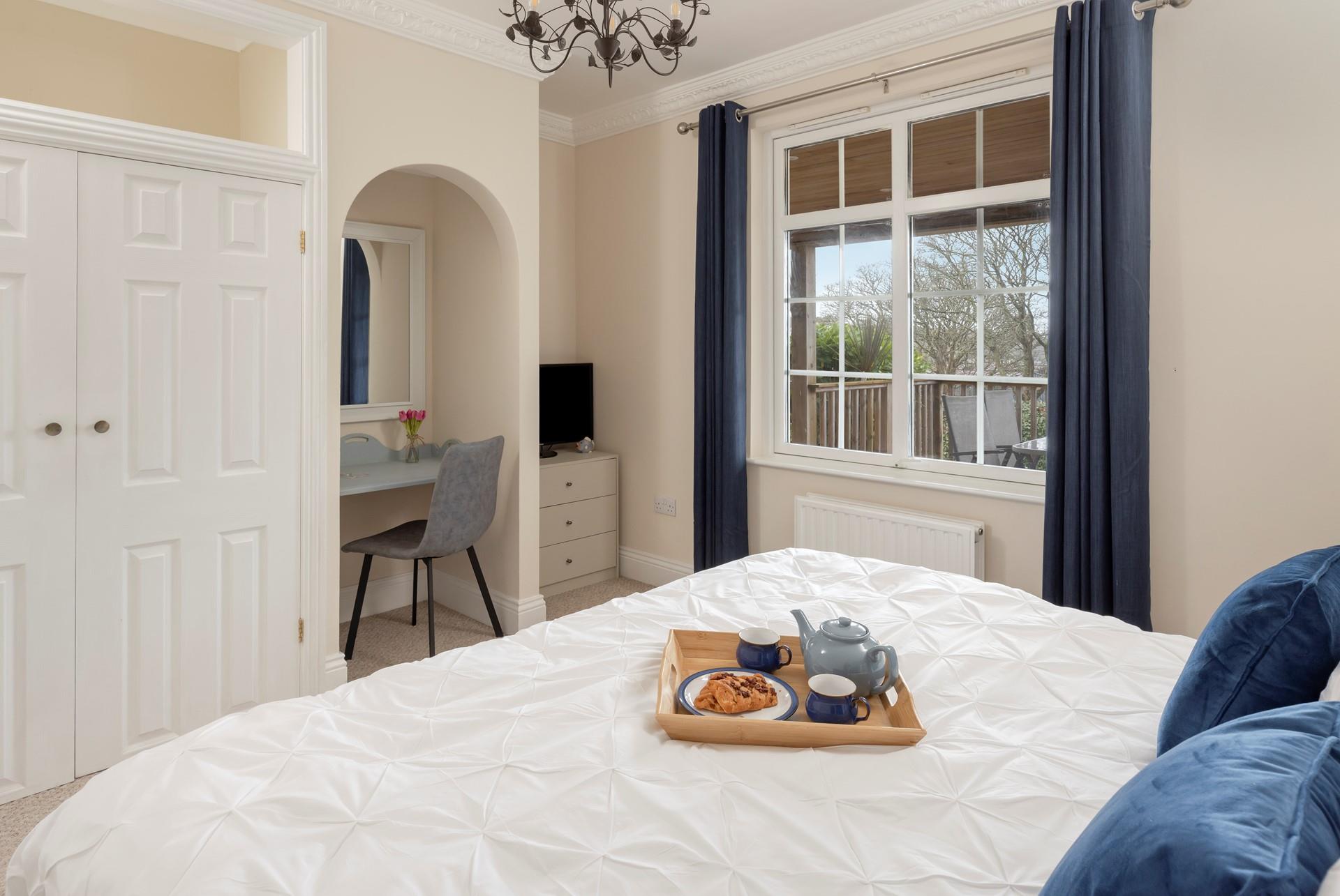 The bedroom is spacious and tastefully decorated. ( The neighbour's terrace is visible from this bedroom, as seen in the  picture)