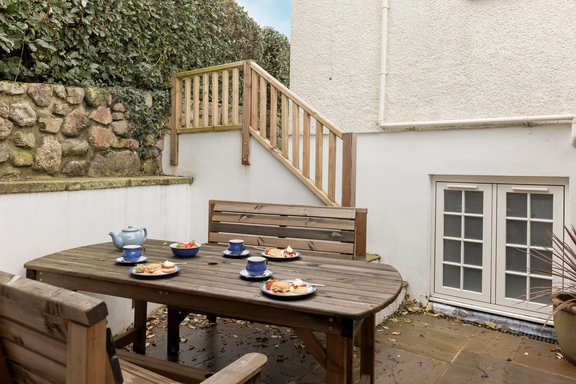 The patio is the perfect spot to soak up the sunshine in the warm summer months.