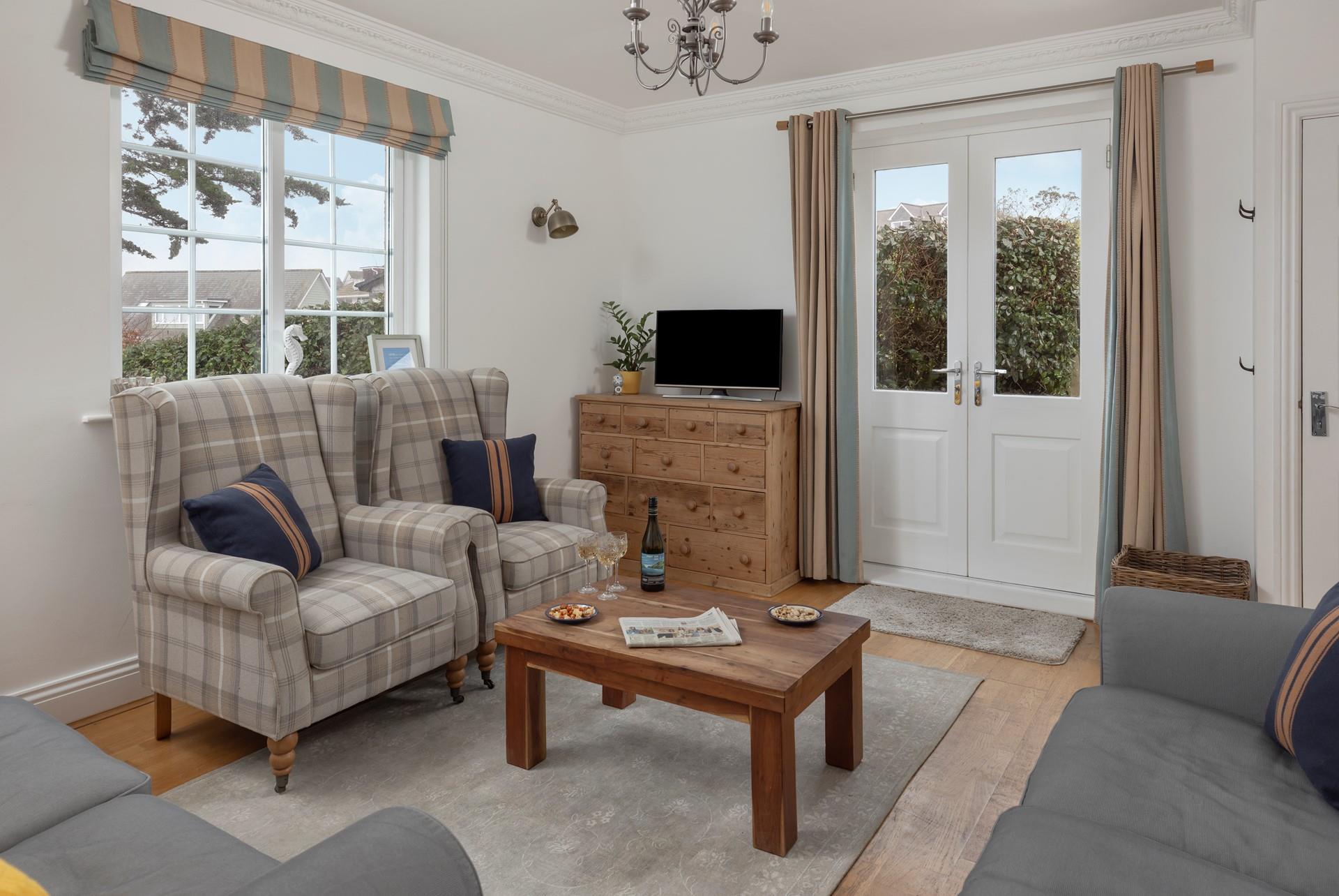 The cosy sitting room has seating for the whole family to spend quality time together.