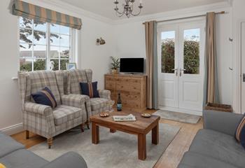 The cosy sitting room has seating for the whole family to spend quality time together.