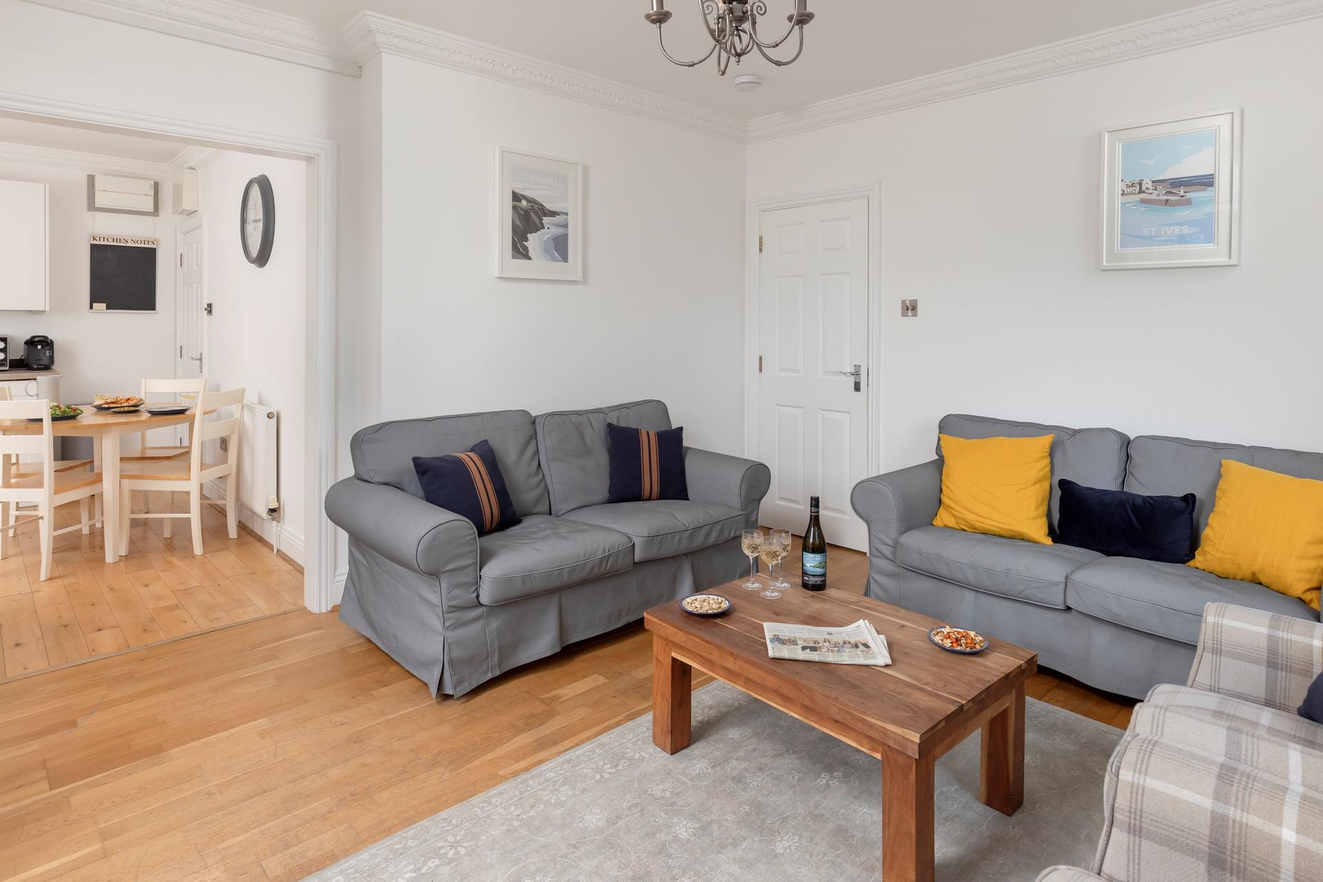 The bright and cosy sitting room is ideal for relaxing evenings.