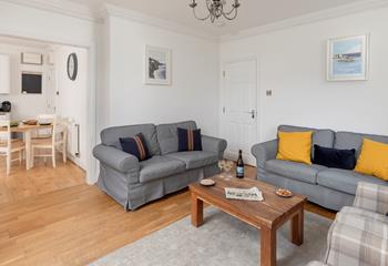 The bright and cosy sitting room is ideal for relaxing evenings.