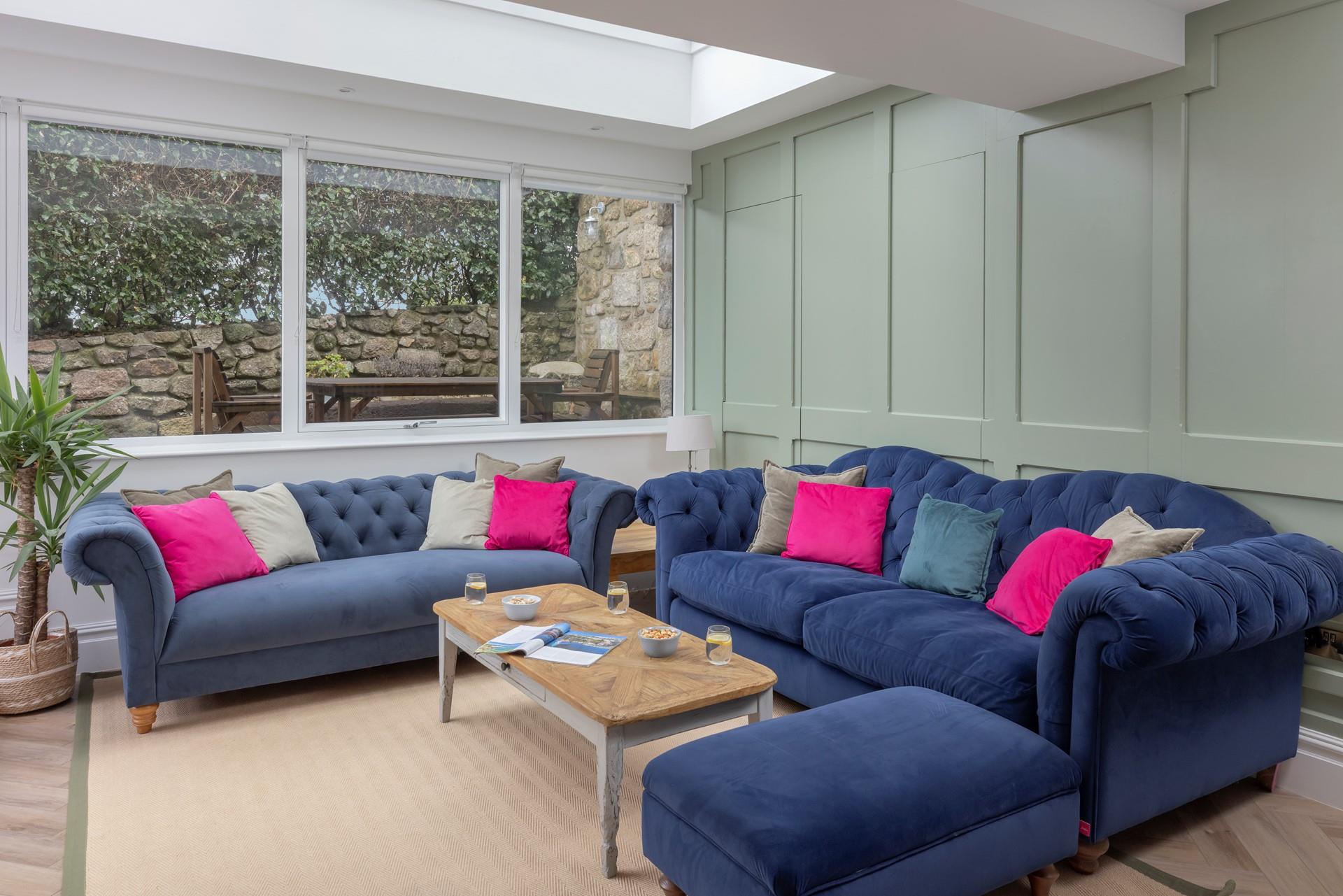 We love the bright and airy sitting room, which is perfect for unwinding after a day at the beach!