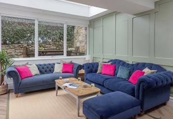 We love the bright and airy sitting room, which is perfect for unwinding after a day at the beach!