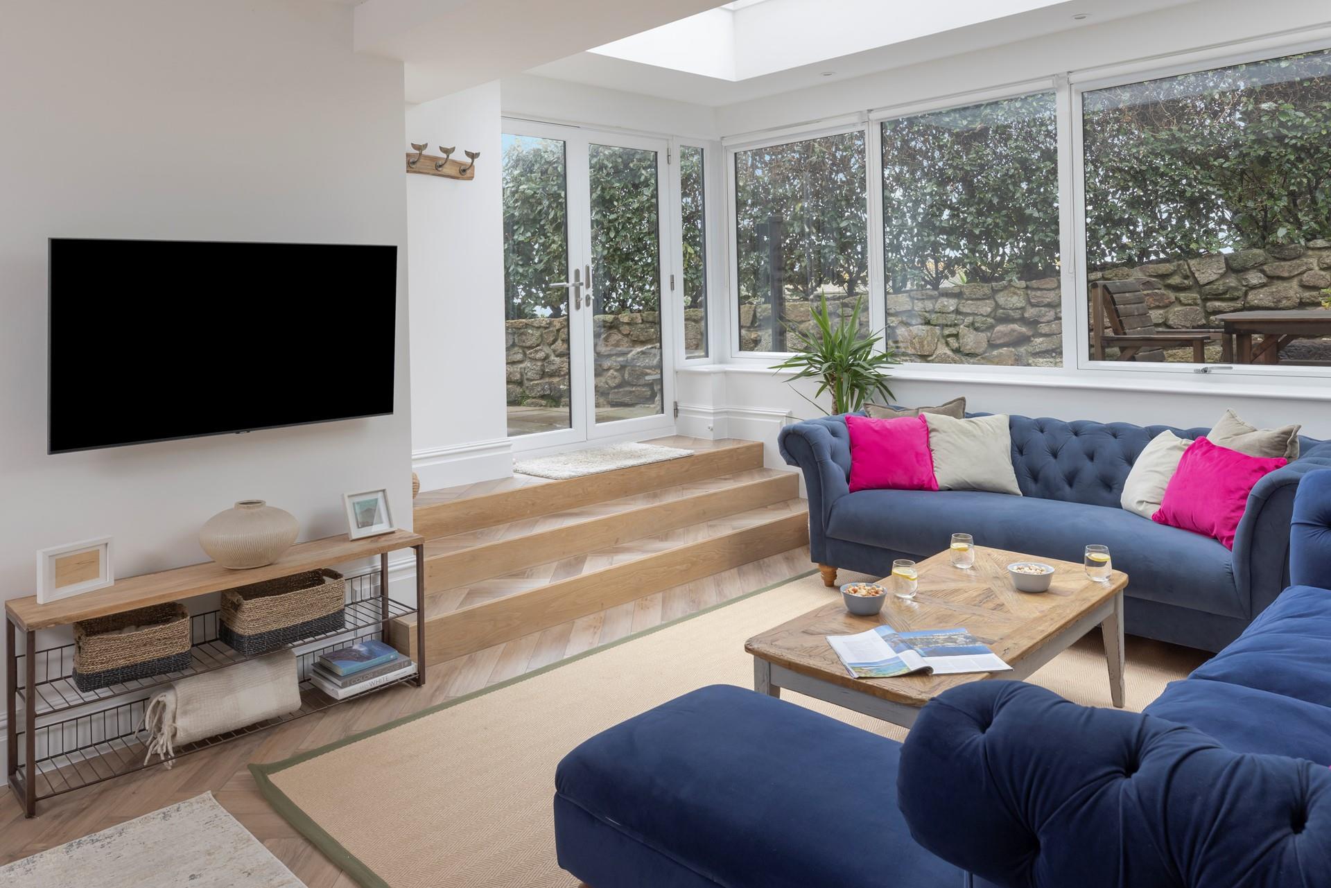 Sink into the comfortable sofa and enjoy a family movie night.