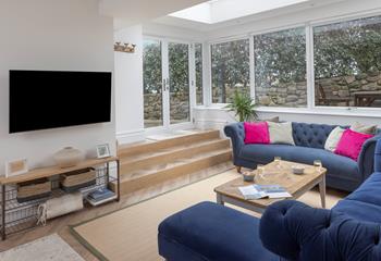 Sink into the comfortable sofa and enjoy a family movie night.