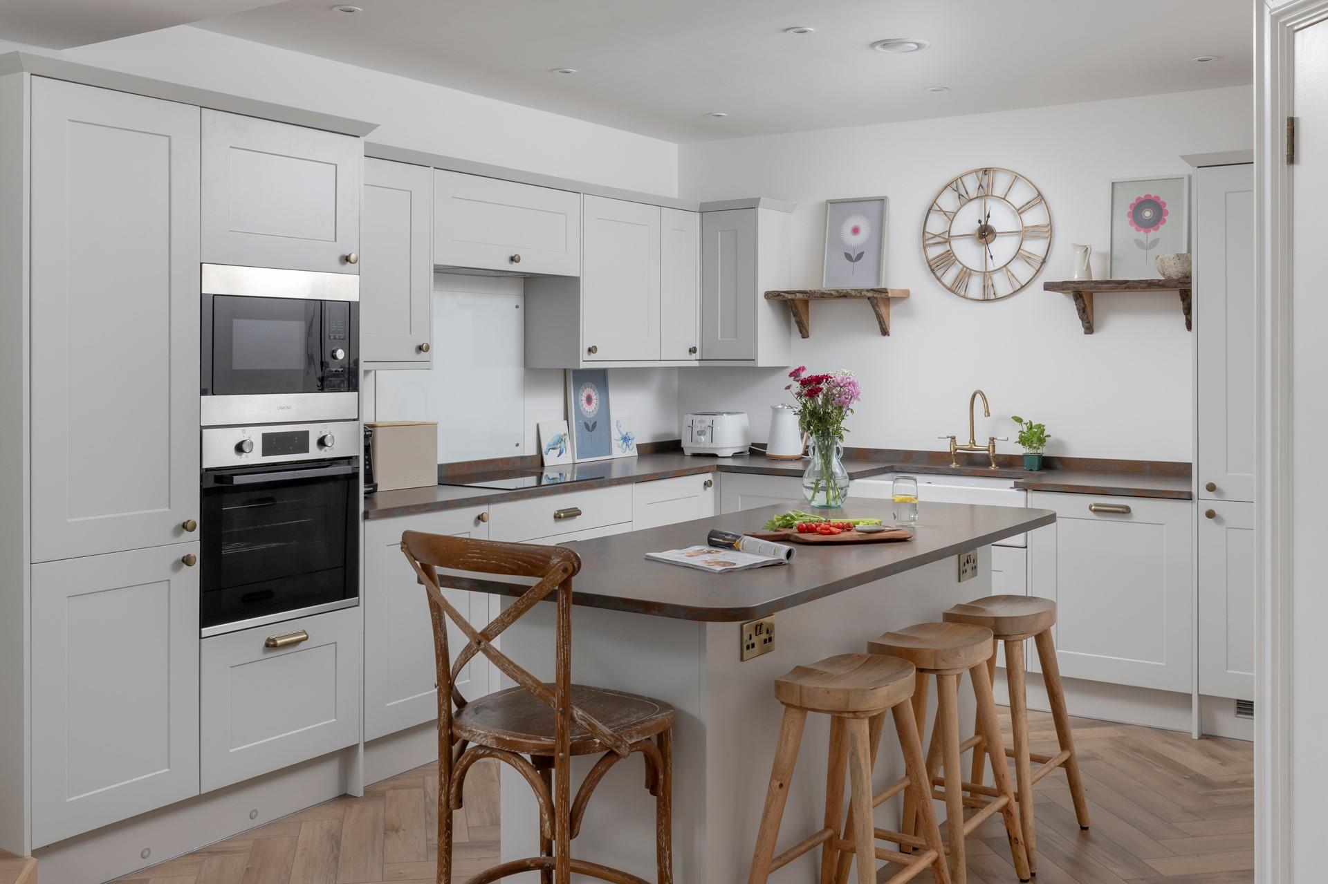 The chef of the family will enjoy cooking in the modern kitchen space.