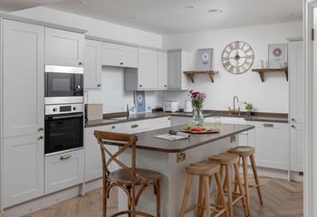 The chef of the family will enjoy cooking in the modern kitchen space.