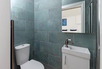 The en suite shower room is modern and stylish.