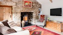 The sitting room is a cosy spot for movie nights, board games and lazy afternoons. 