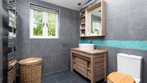The downstairs cloakroom and steam room is perfect to unwind in. 