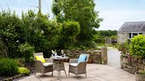 Relax in the sunshine and enjoy the peace and quiet with a refreshing drink.