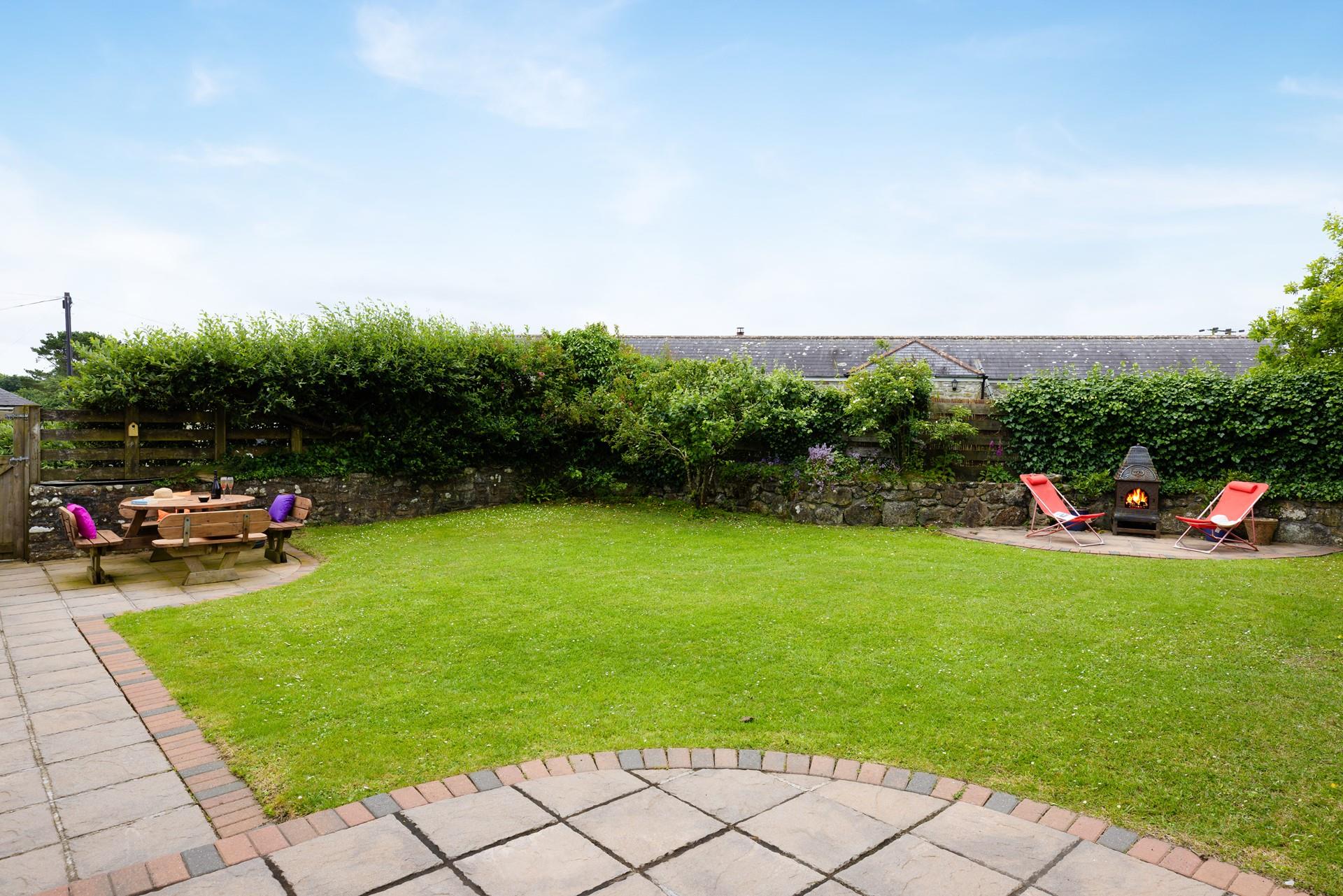 The enclosed garden is a secure outdoor haven for the whole family to enjoy. 