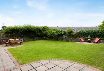 The enclosed garden is a secure outdoor haven for the whole family to enjoy. 
