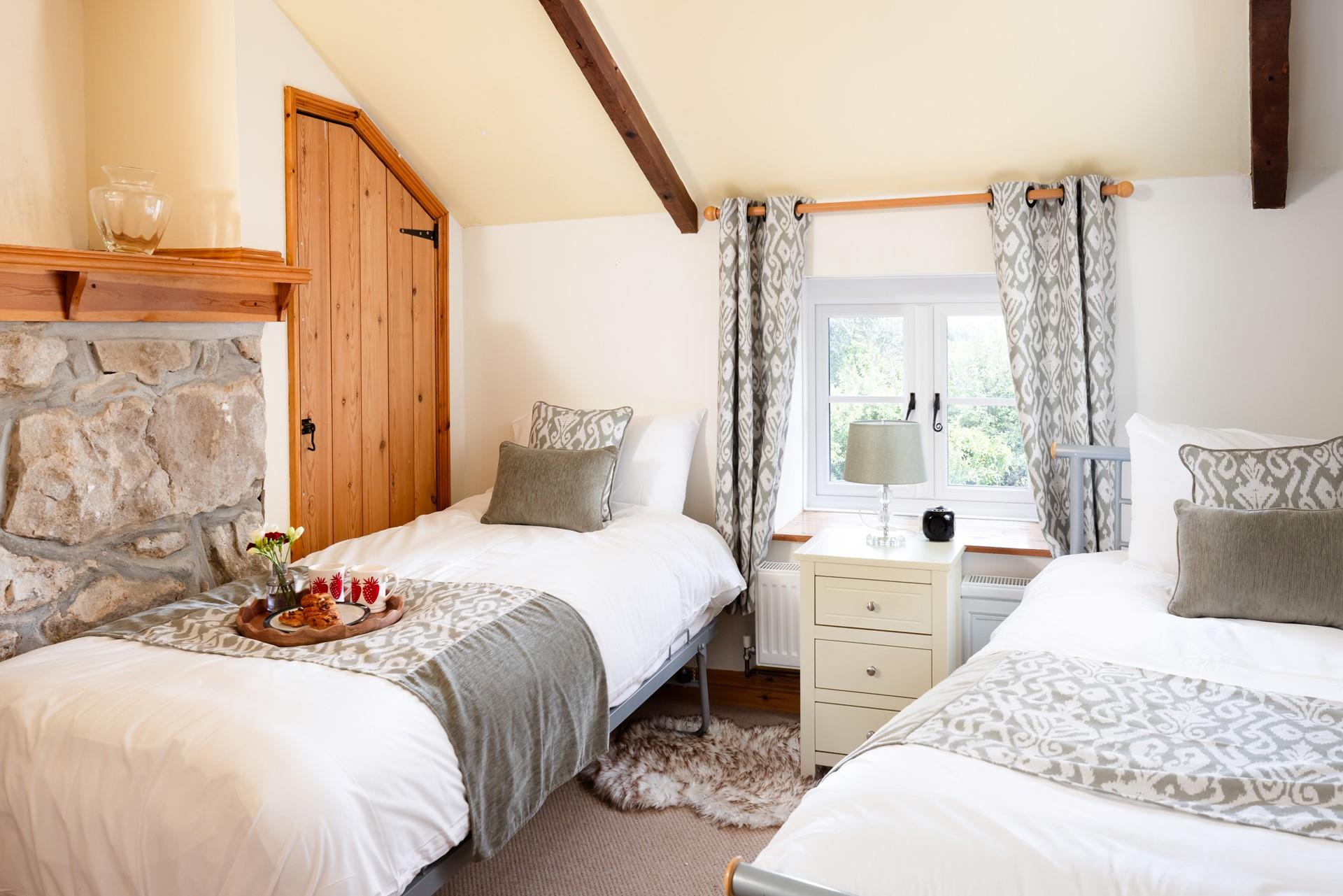 The twin beds are perfect for little adventurers to share stories after a day outdoors. 