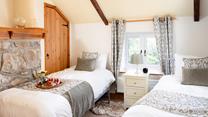 The twin beds are perfect for little adventurers to share stories after a day outdoors. 