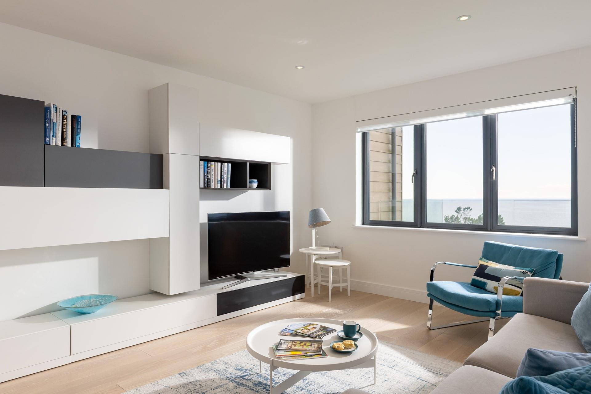 Sit in the stylish sitting room and enjoy the waves.